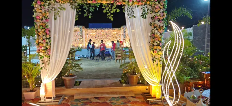 Floral entrance gate with LED leaf light sculpture