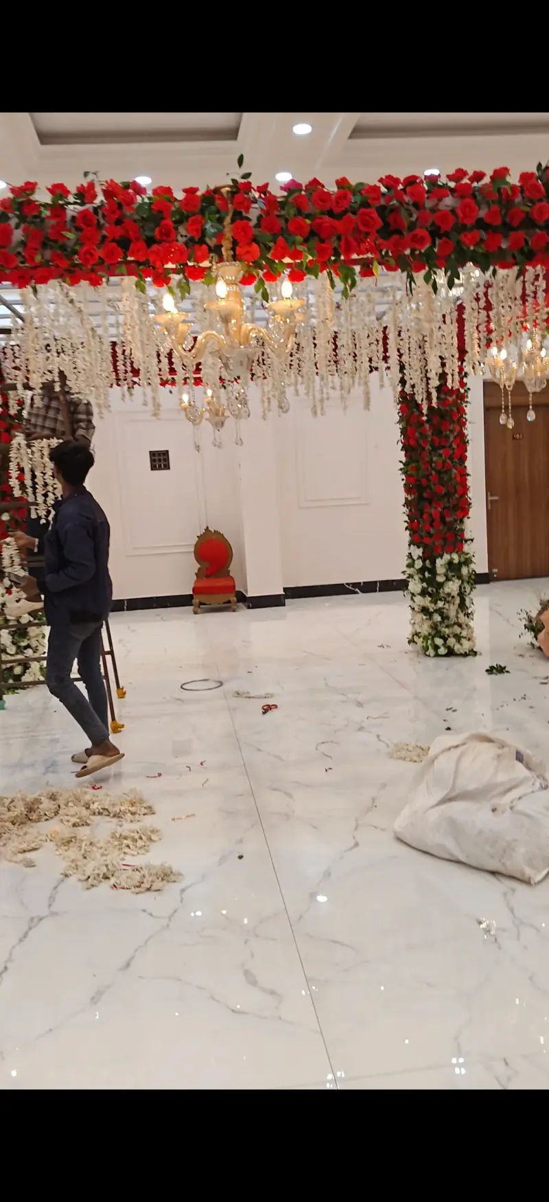 Red rose mandap decoration with chandeliers