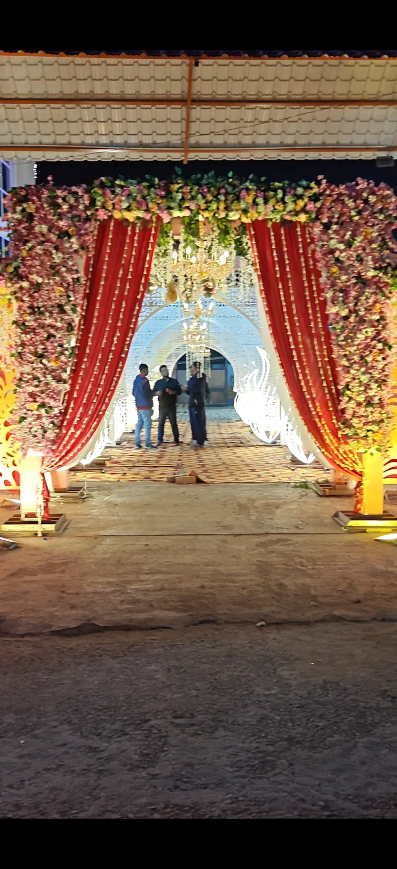 Wedding entrance with floral gate and drapes